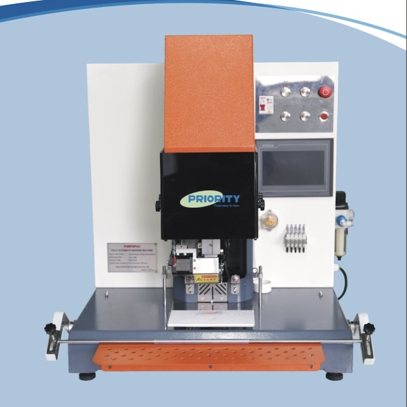A commercial single ply fabric cutting machine processing digital textiles on a factory floor