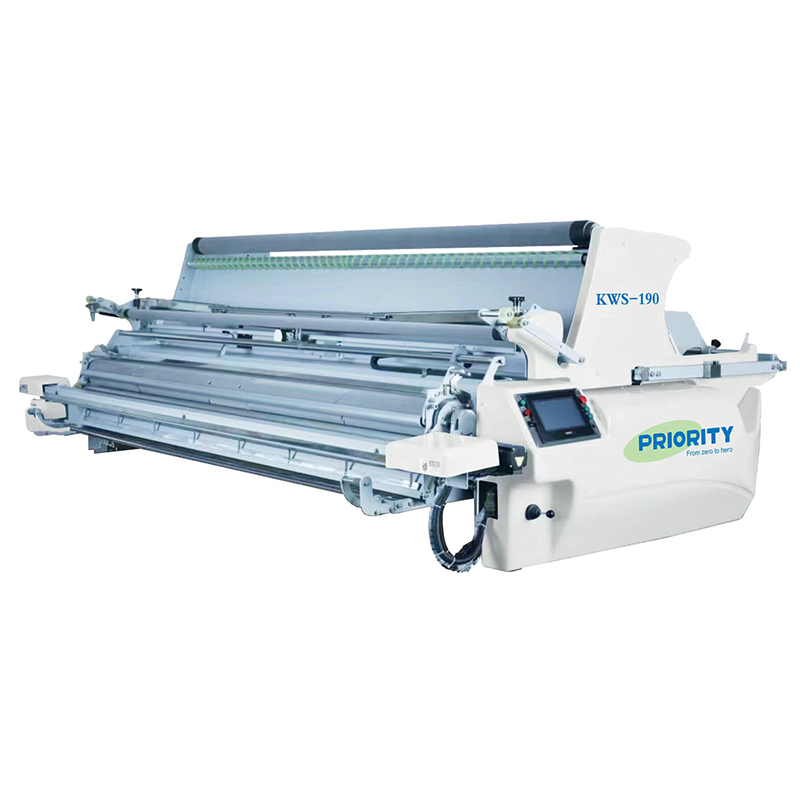 Automated fabric spreading machine operating in a cutting room